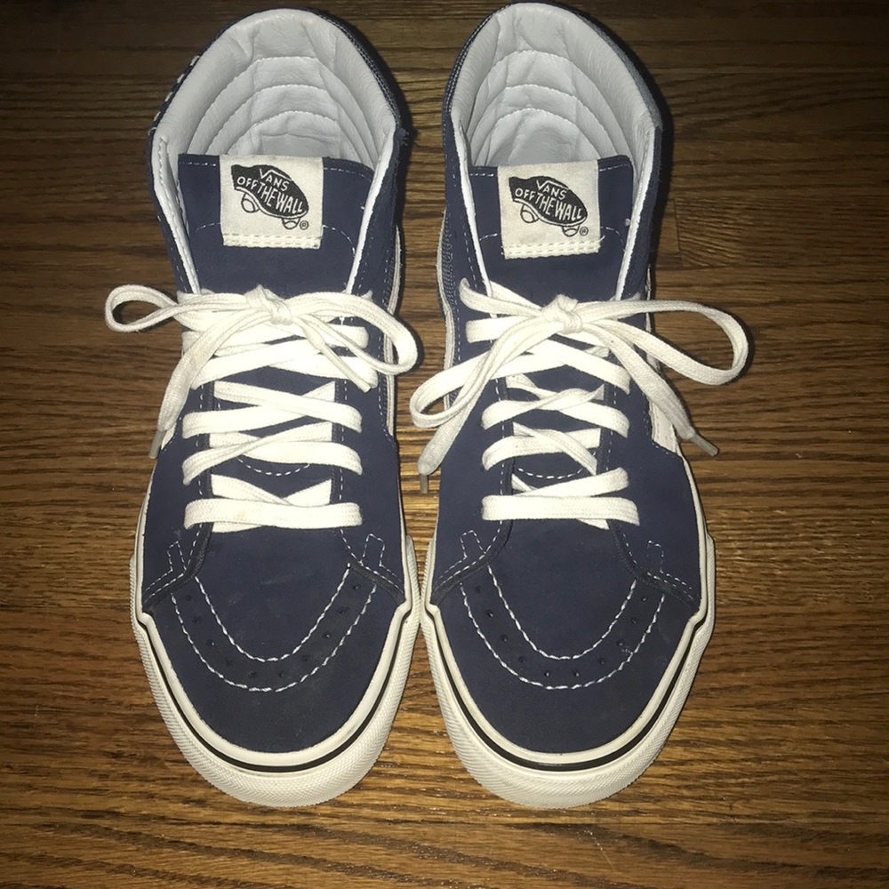Navy Vans with pattern on the side.